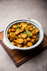 Stir fried taro roots. Arbi ki sabji, ghuiya masala curry Sabzi or arvi dum Masala. Garnished with coriander