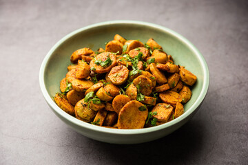 Stir fried taro roots. Arbi ki sabji, ghuiya masala curry Sabzi or arvi dum Masala. Garnished with coriander