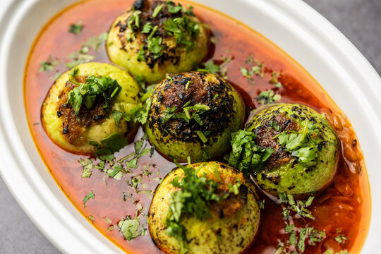 Indian style Tinda or Tinde ki Sabzi also called Indian squash, round melon, Indian round gourd or Indian baby pumpkin, stuffed, stir fried dry or curry recipe
