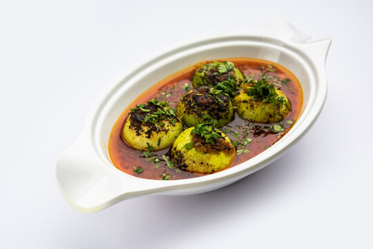 Indian style Tinda or Tinde ki Sabzi also called Indian squash, round melon, Indian round gourd or Indian baby pumpkin, stuffed, stir fried dry or curry recipe