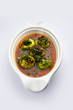 Indian style Tinda or Tinde ki Sabzi also called Indian squash, round melon, Indian round gourd or Indian baby pumpkin, stuffed, stir fried dry or curry recipe