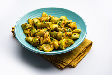 Indian style Tinda or Tinde ki Sabzi also called Indian squash, round melon, Indian round gourd or Indian baby pumpkin, stuffed, stir fried dry or curry recipe