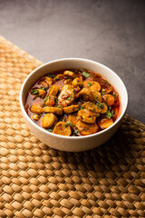 Stir fried taro roots. Arbi ki sabji, ghuiya masala curry Sabzi or arvi dum Masala. Garnished with coriander