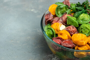 Traditional dumplings made from multi-colored dough. fresh boiled dumplings, Meat dumplings, homemade pelmeni, place for text, top view