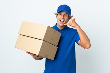 Delivery man over isolated white background making phone gesture. Call me back sign