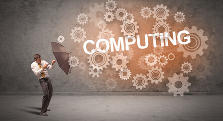 Obraz premium Businessman defending with umbrella concept concept