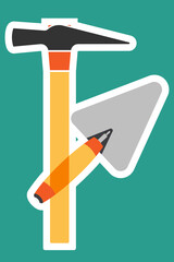 Hammer and trowel on a green background