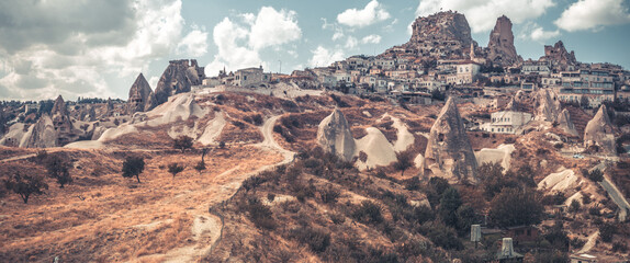 Uchisar settlement located on mountain in Turkey, panorama