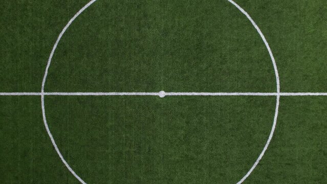 DRONE AERIAL FOOTAGE - Aerial view of a Sports field in a residential area with artificial green grass and a football goal in Santo Tirso, Portugal. Soccer pitch.