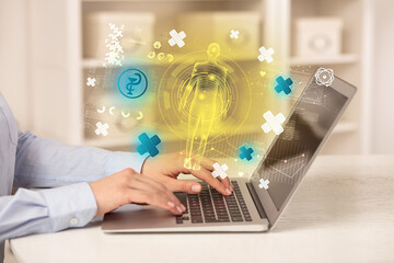 Doctor working on laptop with healthcare concept