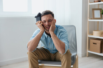 Upset frustrated young tanned wasted mission with joystick gamepad reclines on hand at home. Stream Platform for gamers concept. Relaxing Active recreation. Copy space for game console advertising © SHOTPRIME STUDIO