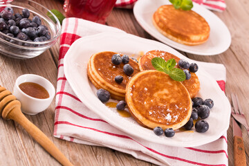 Pancakes with blueberries and chocolate cream.