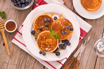 Pancakes with blueberries and chocolate cream.