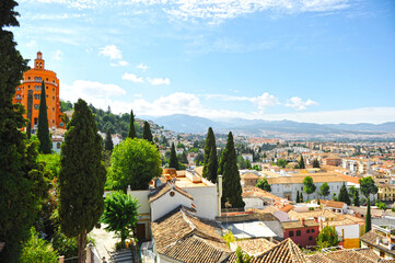 El Realejo district in Granada with Sierra Nevada in the background. Granada is one of the most...