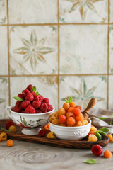 Ripe juicy raspberries in a small bowl. Summer harvest of delicious berries.