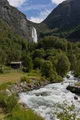 Fototapeta na wymiar Vertical view to the giant Feigumfossen Waterfall.