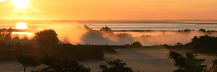 Scenic panoramic view  to the wadden sea in the morning fog from the Høstbjerg dune viewpoint.