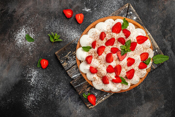 delicious strawberry tart pie or cake on a dark background. Home baking, organic food
