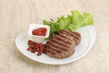 Grilled beef burger cutlet with sauce