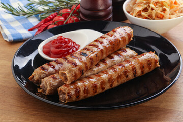 Grilled sausages with cabbage and sauce