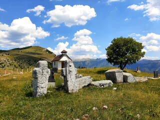 Old stone church with tombstones in Blace, mountain Bjelasnica, Bosnia and Herzegovina