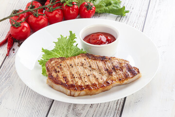 Grilled pork steak with ketchup