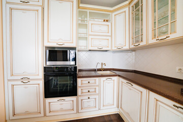 Fototapeta premium built-in home appliances. The interior of kitchen in a classic style. 