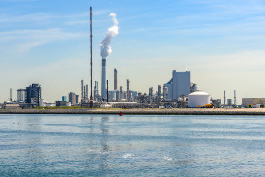 View of an oil refinery on a sunny summer day. Port of Rotterdam, Netherlands.