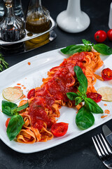 Pasta Fettuccine Bolognese with tomato sauce in white plate