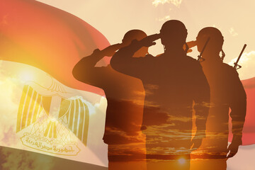 Fototapeta premium Double exposure of Silhouettes of soliders and the sunset or the sunrise against flag of Egypt. Greeting card for Independence day, Memorial Day, Armed forces day, Sinai Liberation Day.