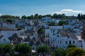 ALBEROBELLO, ITALY, 19 AUGUST 2021 Tourists in Alberobello, town with typical houses called...