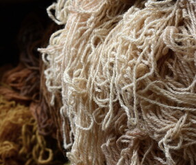 Colorful collection of wool for knitting and weaving. Full frame shot of multi colored yarn.