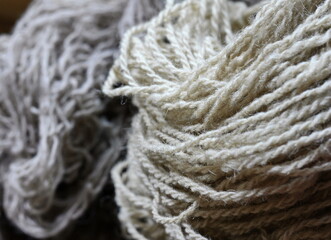 Colorful collection of wool for knitting and weaving. Full frame shot of multi colored yarn.