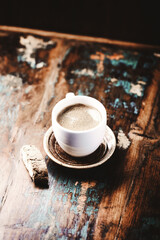 Cup of coffee and Cantuccini (Italian cookie) on dark wooden background. Copy space.	