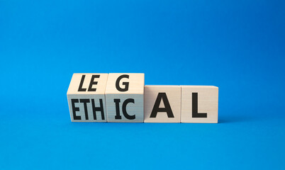 Ethical and Legal symbol. Turned wooden cubes with words Ethical and Legal. Beautiful blue background. Business and Ethical and Legal concept. Copy space