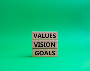 Values Vision Goals symbol. Concept words Values Vision Goals on wooden blocks. Beautiful green background. Business and Values Vision Goals concept. Copy space.