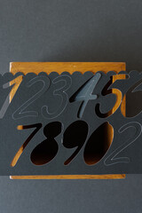 Naklejka premium background with numbers (paper and wood box ground)