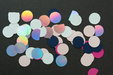background with paper circle motifs - shiny and plain paper circle shapes on gray paper