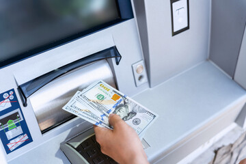 Atm machine money cash. Holding american bill cash. Woman withdraw money usd hundred dollar. Us dollar bill, bank credit card.