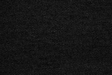 Black woolen tweed fabric pattern close up as background