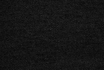 Black woolen tweed fabric pattern close up as background