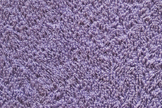 Purple color towel fabric texture, fuzzy fabric texture as background