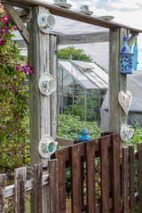 Doorway to an allotment with cups and saucers