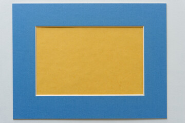 Fototapeta premium yellow paper and blue frame