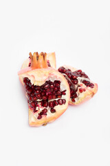 chunks of juicy pomegranate close-up on a white background.