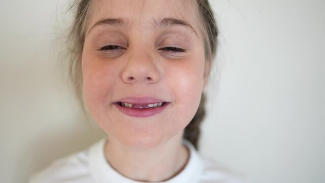 baby no teeth. child smiling no milk a teeth fell out. medicine dentistry happy end family. girl kid close-up smile without teeth lifestyle. daughter without front teeth portrait