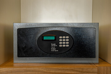 front loading in-room hotel safe with electronic lock located inside a closet.has a keypad and seven-segment LED display
