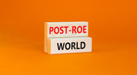 Roe vs Wade post-Roe world symbol. Concept words Post-Roe world on wooden blocks on a beautiful orange table orange background. Business and Roe vs Wade post-Roe world concept. Copy space.