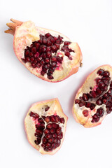 chunks of juicy pomegranate close-up on a white background.