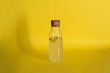 glass bottle with cold summer lemon fresh